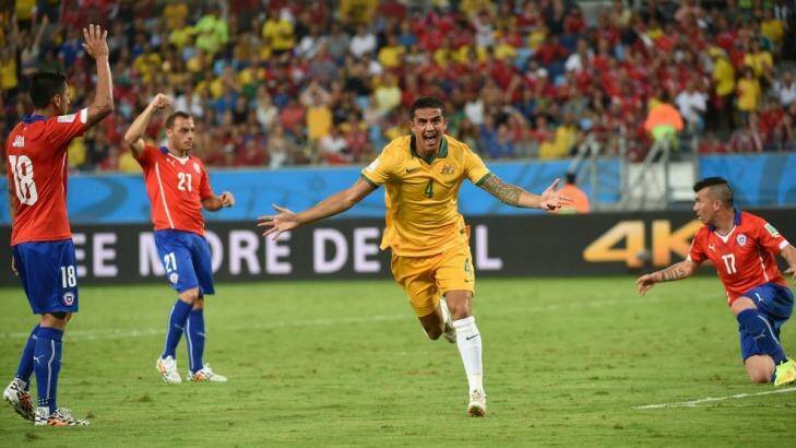 Tim Cahill celebrates playing a part in the 2014 World Cup goalfest during Australia's opening Group B match against Chile.      Photo: William West