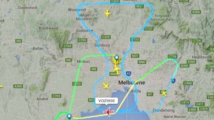 It took three pilots 32 minutes to "draw" the AFL premiership cup over Melbourne on grand final day.