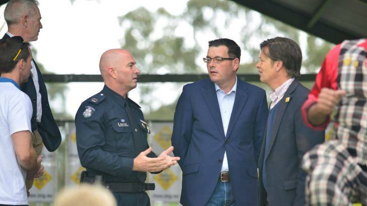 Premier Daniel Andrews with Roads Minister Luke Donnellan, right, and Victoria's head of road policing, Assistant Commissioner Doug Fryer, left.  Photo: Anthony M Leong