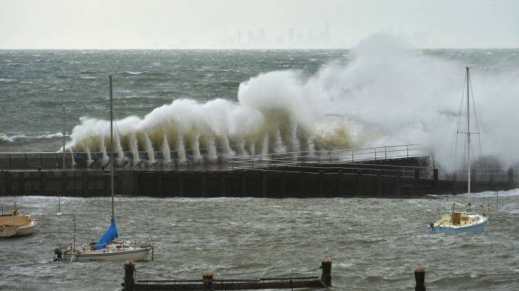 A large wave crashes against the Mornington pier during Tuesday's storm. Photo: Joe Armao