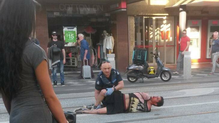 Police used pepper spray to subdue a man after being called to an Acland Street brawl just before 7pm. Photo: Les Lothringer