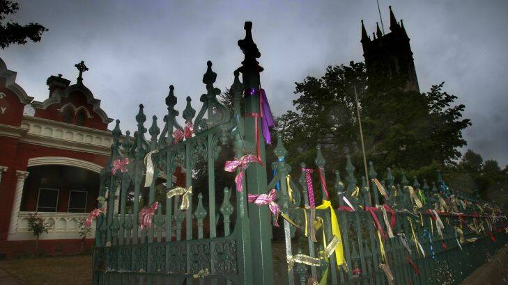 Photograph Simon O'Dwyer. The Age Newspaper. 170216. Photograph Shows. St Alipius Presbytary, church and old boys school in Ballarat have ribbons tied to their fences to symbolise the abuse of catholic priests.