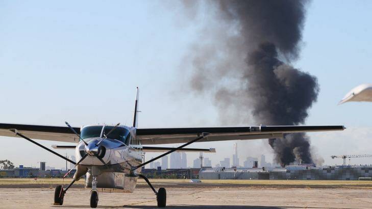 A plume of smoke from the crash at Essendon Airport on Tuesday.  Photo: Michael Dodge
