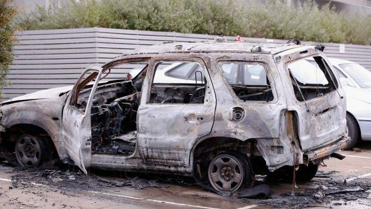 A burnt out vehicle found in North Coburg believed to have been used in the police shooting. Photo: Darrian Traynor