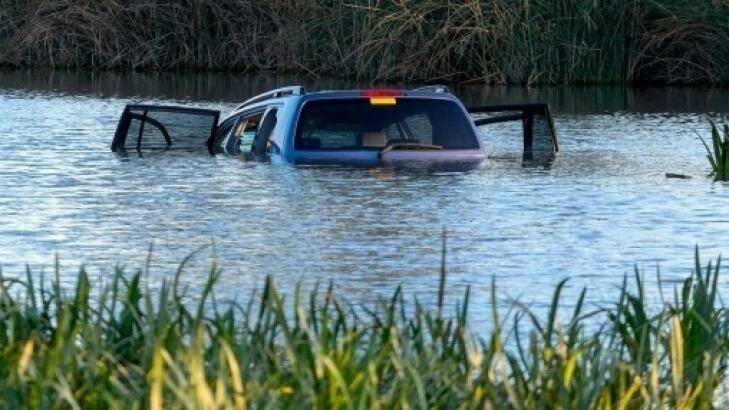 The three children died after a car was driven into a lake in Wyndham Vale. Photo: Luis Ascui