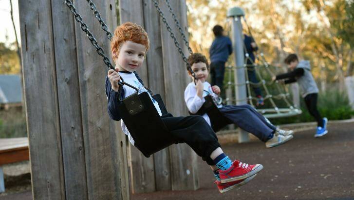 Luke Williamson (left) and twin brother Ben play at Brimbank Park. Photo: Joe Armao