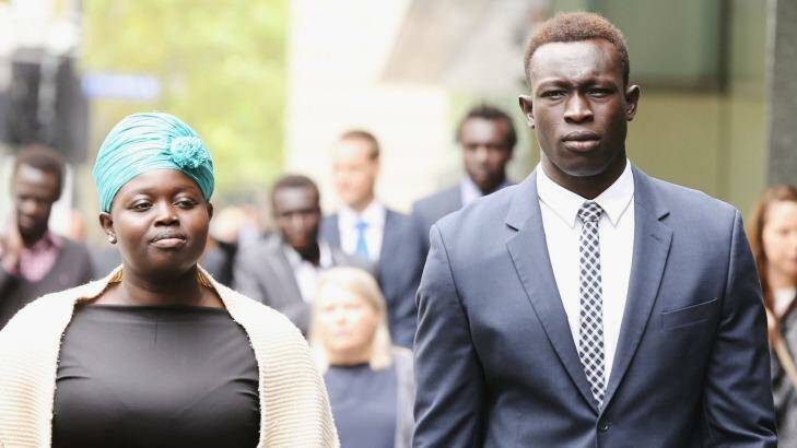 Former North Melbourne player Majak Daw outside the County Court with his sister, Sarah Daw. Photo: Michael Dodge