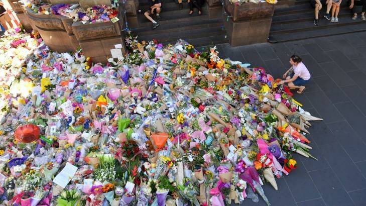 Love of the people: The mass of flowers placed by the public outside Melbourne GPO in tribute to the victims of the Bourke Street tragedy.  Photo: Joe Armao