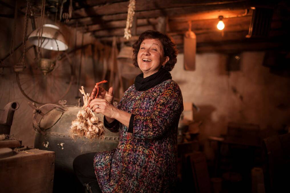 FINALIST: "Chef Rosa Mitchell inspects dried garlic in the cellar of her inherited 1860s farmhouse. Mitchell's restaurant Rosa's Kitchen sources many of its ingredients from the family's farm in Yandoit, Victoria." Photo: Robert Geary