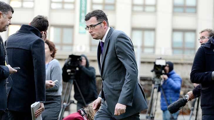 Daniel Andrews leaves a media conference on Monday. Photo: Justin McManus