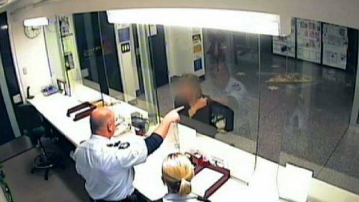 Still video images of one of the confrontations at Ballarat Police Station.