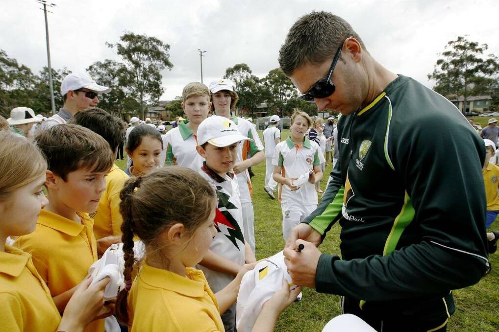 Michael Clarke signs autographs for children at the Kotara South Public School in Kotara, a suburb of Newcastle, on Monday. Photo: Ryan Osland