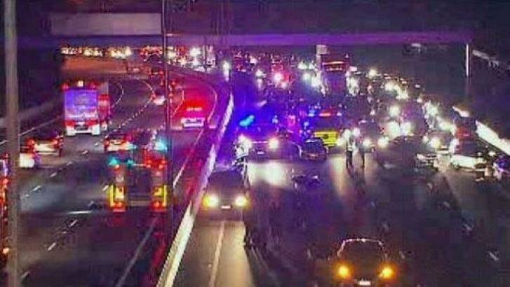 Police at the scene of the motorcycle crash on the Monash Freeway at Malvern. Photo: Ten Eyewitness News