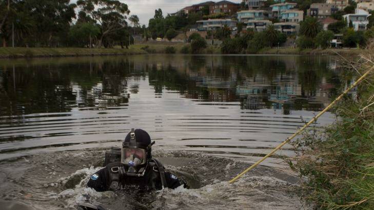 Police divers scour the Maribyrnong River for the body parts of Brendan Bernard in February 2015. Photo: Jason South
