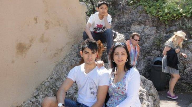 Renu Fotedar with her sons Tushar (seated) and Sahil (at back).  Photo: Supplied