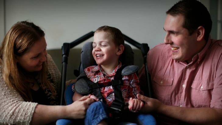 Cooper Wallace, who needs medical cannabis, and his parents Cassie Battena and Rhett Wallace.
 Photo: Eddie Jim