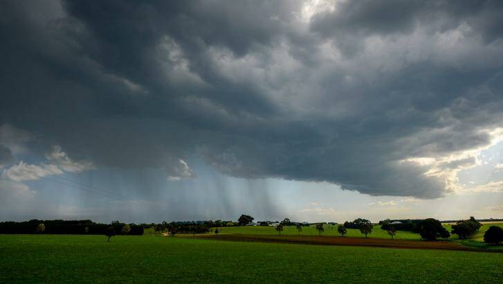 Rain and storm clouds on the outskirts of Lancefield on Friday. Photo: Justin McManus