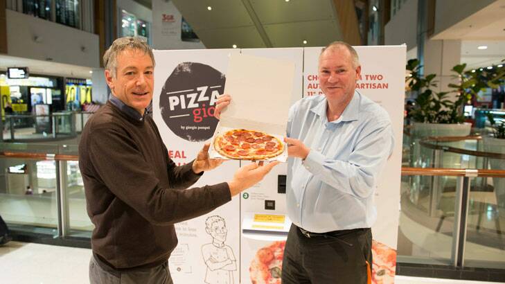 George Pompei with a happy Pizza Gio customer.