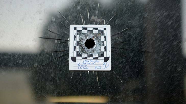 A bullet hole at the front of a police impound yard in Preston.  Photo: Justin McManus