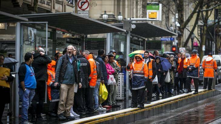 Waiting, waiting ... commuters at a tram stop after the four-hour stop work ended. Photo: Eddie Jim