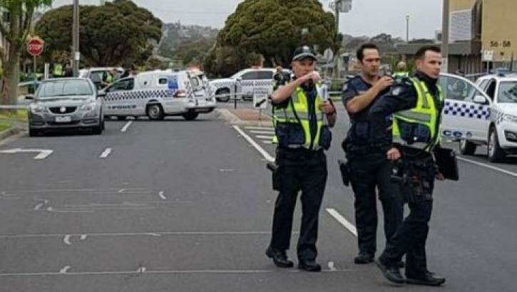 Police near the scene where a police officer opened fire on a man in Dandenong on Wednesday.  Photo: Channel Nine