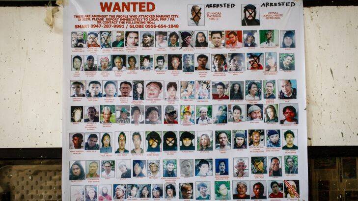 Poster of wanted terrorists in the Marawi area. Photo: Sitthixay Ditthavong