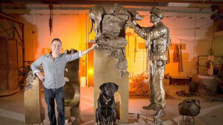 Melbourne sculptor Ewen Coates with his sculpture commemorating the army dogs who died detecting bombs. Photo: Jason South