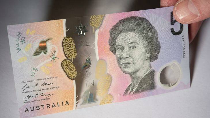 Some machines are spitting out the new $5 note.  Photo: Christopher Pearce