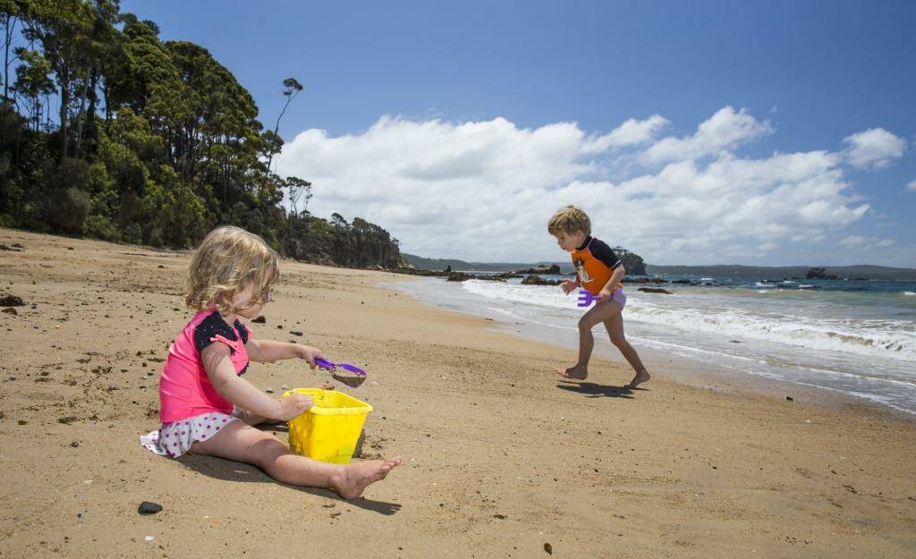 Maddy, 2, and Casey Matthews-James, 4, from England enjoy an outing to Batemans Bay this week. The temperatures will start to climb from Saturday, reaching the mid-30s in western Sydney. Photo: Matt Bedford