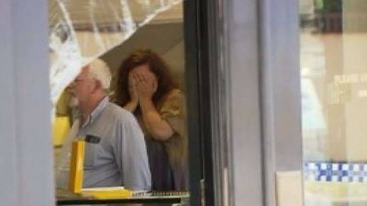 Distressed staff inside the Holloway Diamonds store. Photo: Courtesy of Seven News