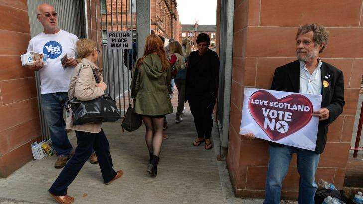 Voters come to Notre Dame Primary School polling station as the people of Scotland take to the poles to decide their country's fate in a historic vote in Glasgow, Scotland. Photo: Mark Runnacles/Getty Images