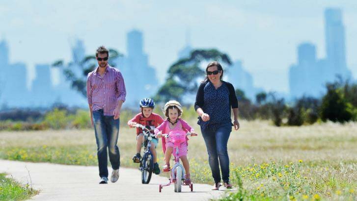 Jason, William (seven), Lucy (four) and Alice Osborne enjoy living and the bike tracks surrounding Point Cook. Photo: Joe Armao