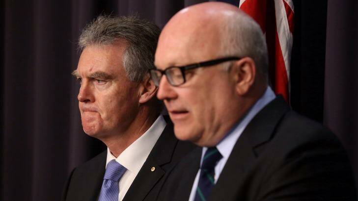 Duncan Lewis, the new director-general of ASIO, and Attorney-General George Brandis insist Australian security forces will not torture suspects. Photo: Andrew Meares