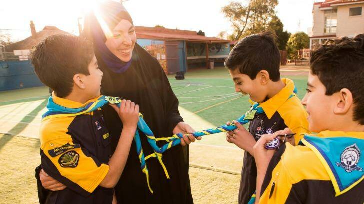Proud Mum: Rasha Ahmed with her three sons Yahya, Younus and Dawoud Salman who were inducted into Australia's first ever all-Muslim cub scout group at the Australian International Academy's King Khalid campus (primary school) in Coburg on Tuesday Photo: Jason South