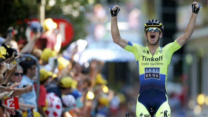 Michael Rogers celebrates as he crosses the finish line to win the 16th stage of the Tour de France.