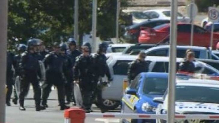 Riot police prepare to enter Malmsbury Youth Justice Centre. Photo: Courtesy of Nine News