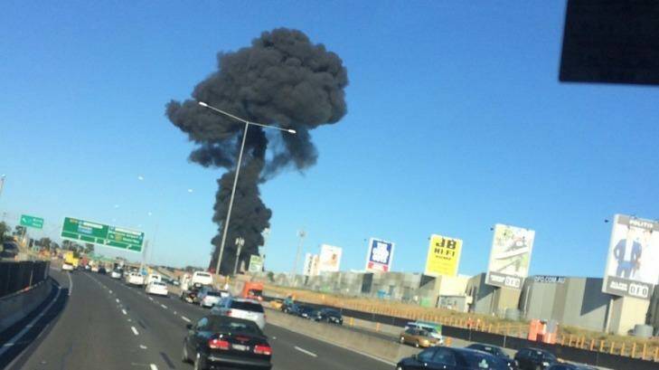 Smoke from the crash at DFO Essendon shopping centre.  Photo: Twitter/@Tsm042