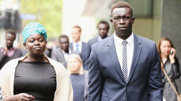 Former North Melbourne footballer Majak Daw outside the County Court on Monday with his sister, Sarah Daw. Photo: Michael Dodge