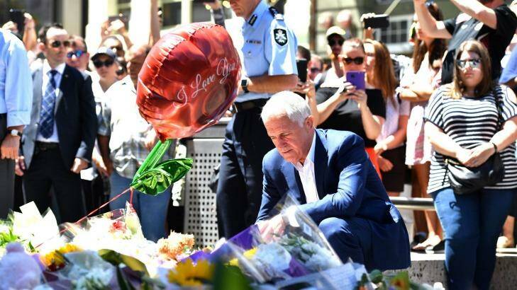 Prime Minister Malcolm Turnbull lays flowers in Bourke Street Photo: Joe Armao