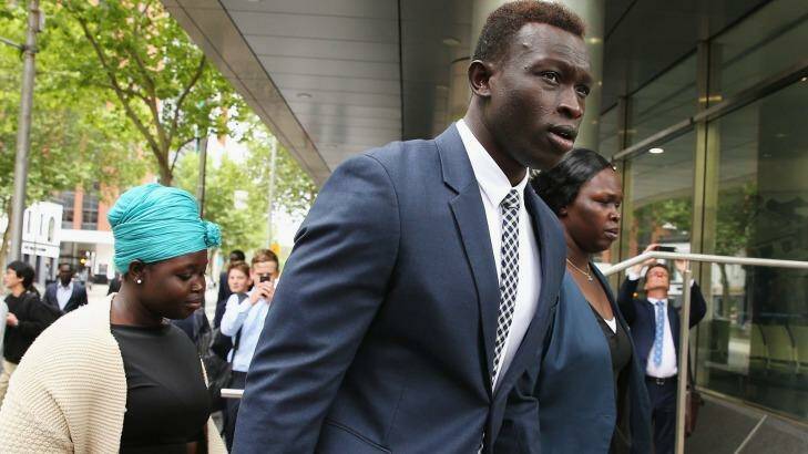 Majak Daw appears at the Victorian County Court supported by his family. Photo: Michael Dodge
