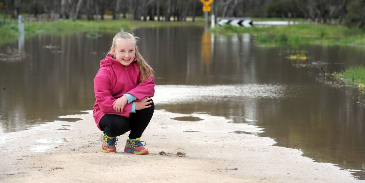 MIDDLE OF THE ROAD: Katelyn Hughes at Pryors Road, Horsham. Rivers and creeks are receding but flash flooding might occur following predicted rain and thunderstorms. Picture: PAUL CARRACHER 