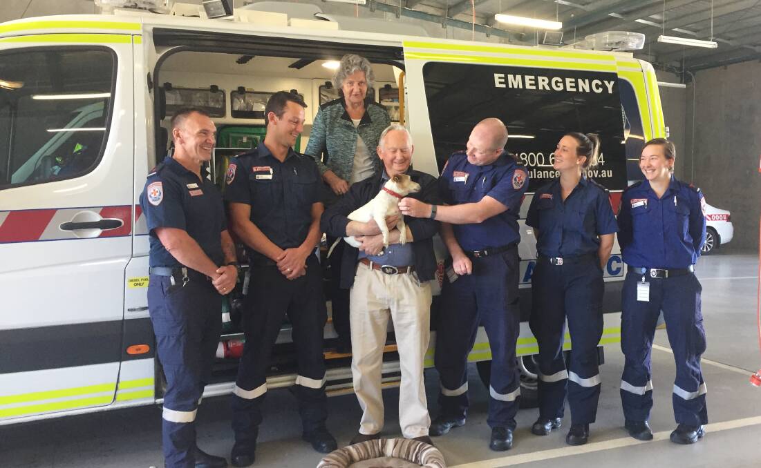 THANKS: Bev and Lindsay Torkington, their pup Jack, and lifesaving paramedics Roger Murray, Matt Perry, Julian Cofield, Anna Brown and Claire Duke. Picture: SOPHIE BOYD 