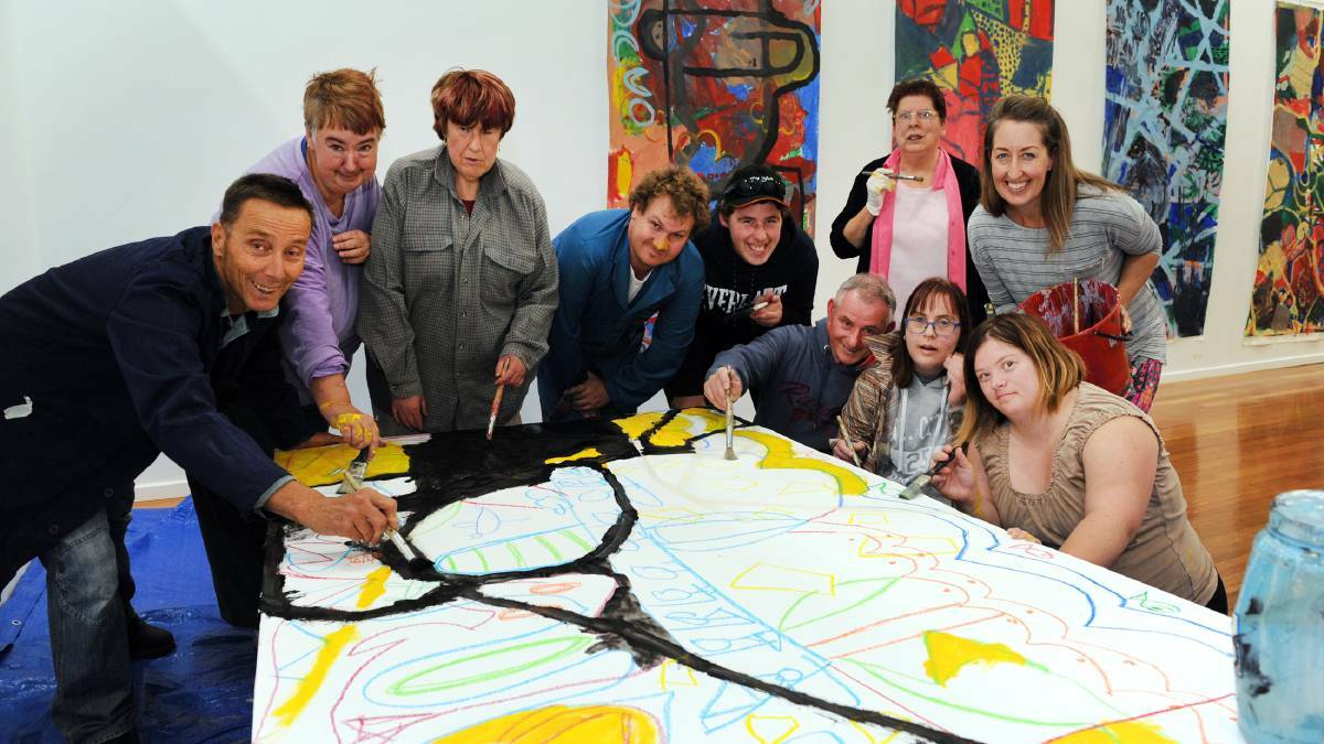 ART MATTERS: Artists Anthony Pelchen, left, and Amy Anselmi, right, with program participants ahead of their successful exhibition. Picture: PAUL CARRACHER