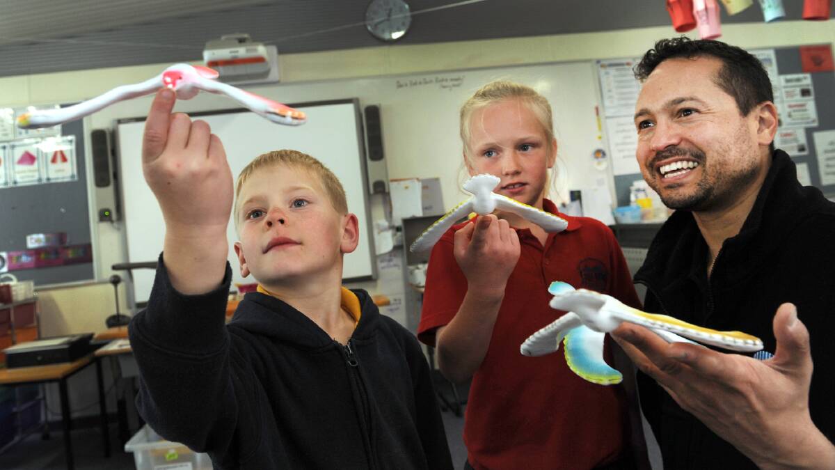 LET’S GET PHYSICAL: Natimuk Primary School student Codi Maybery and Haven Primary School student Larissa Reddie learn about physics with CSIRO’s Jason Morvan at Laharum Primary School. Picture: PAUL CARRACHER