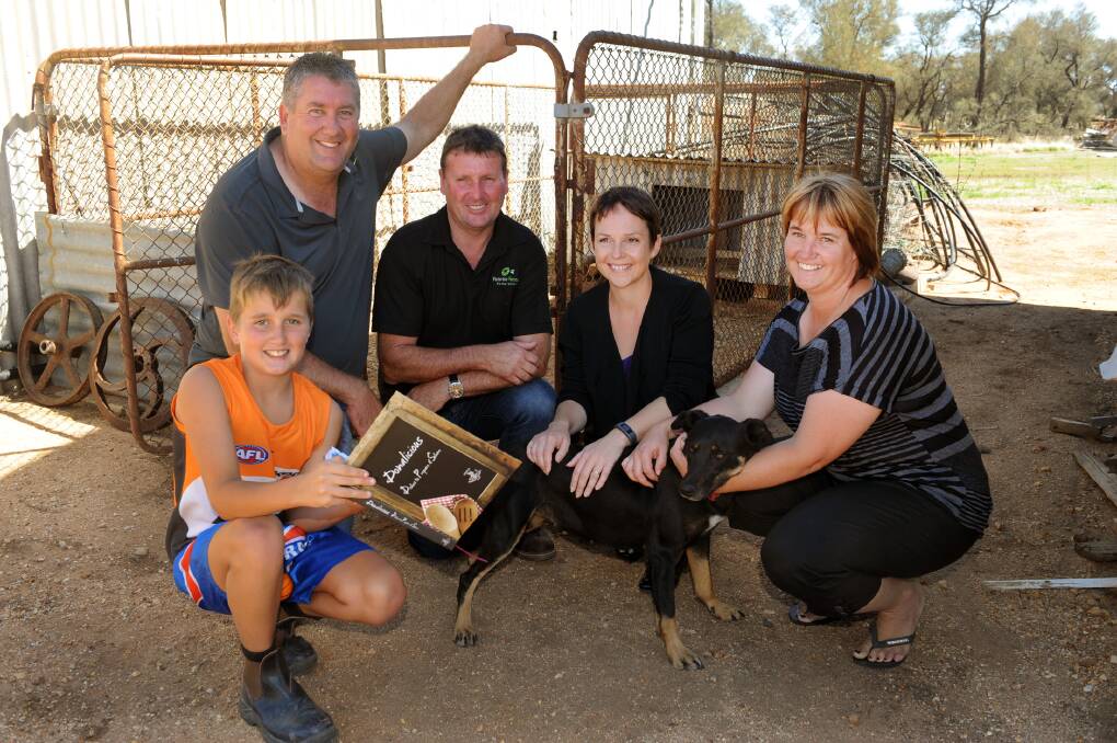ON THE FARM: Agriculture Minister Jaala Pulford, centre, visits the Bath family farm in Cope Cope on Friday. Pictured are Ryan Bath, Brad Bath, Victorian Farmers Federation president Peter Tuohey and Carmen Bath. Ryan presented Ms Pulford with a Donald Primary School Cookbook. Picture: PAUL CARRACHER