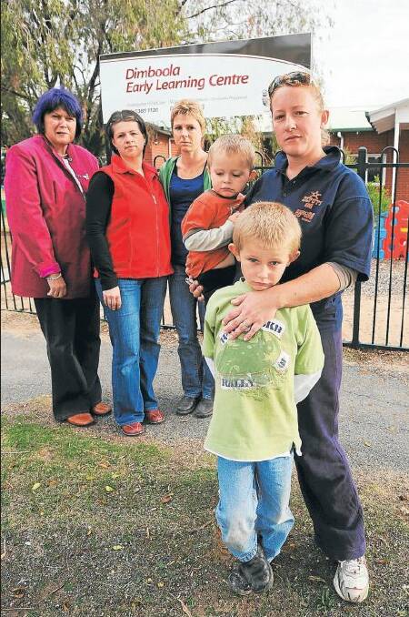 DISGRUNTLED: Wimmera Uniting Care chief executive Wendy Middleton, left, meets concerned Dimboola residents Suzi Wouters, Lisa Barber and Raegan Barber with two-year-old son Felix and six-year-old son Angus. Dimboola and Balmoral parents are angry that their child care centres will be forced to shut. Picture: KATE HEALY