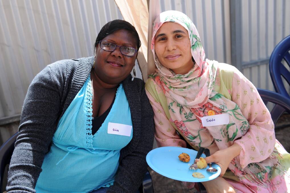 Rupanyup’s Bina Hastings and Horsham’s Sajida Maqbool enjoy a Harmony Day lunch at Volunteering Western Victoria’s Horsham ofﬁce yesterday. The event was part of the Wimmera’s Cultural Diversity Week program. Picture: SAMANTHA 
CAMARRI