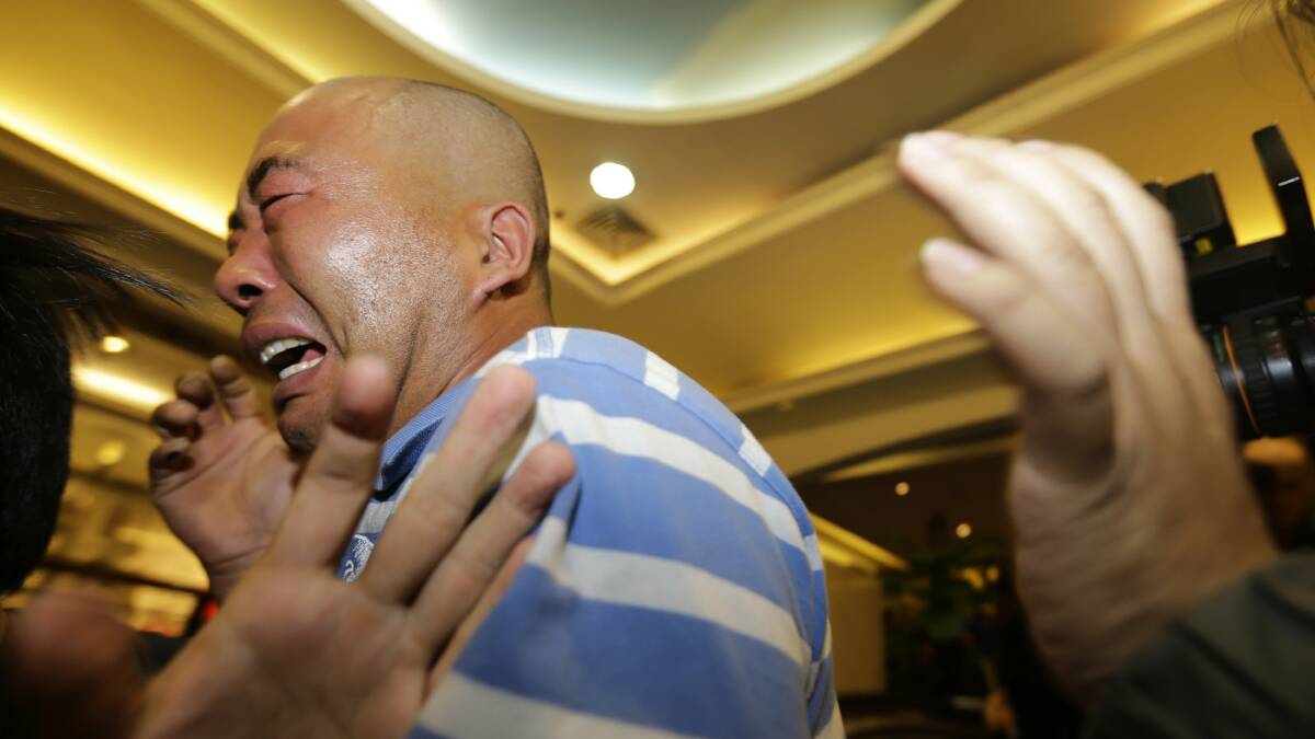 Relatives of passengers aboard Malaysia Airlines MH370 cry after watching a television broadcast of a news conference, in the Lido hotel in Beijing, March 24, 2014. Malaysian Prime Minister Najib Razak has told families of passengers of a missing Malaysian airliner that the plane ended its journey in the southern Indian Ocean. Photo Reuters.
