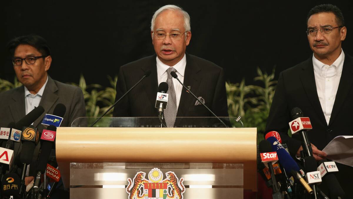 Malaysia's Prime Minister Najib Razak makes an announcement on the latest development on the missing Malaysia Airlines MH370 plane at Putra World Trade Center in Kuala Lumpur March 24, 2014. Prime Minister Najib has told families of passengers of a missing Malaysian airliner that the plane ended its journey in the southern Indian Ocean. Photo Reuters.