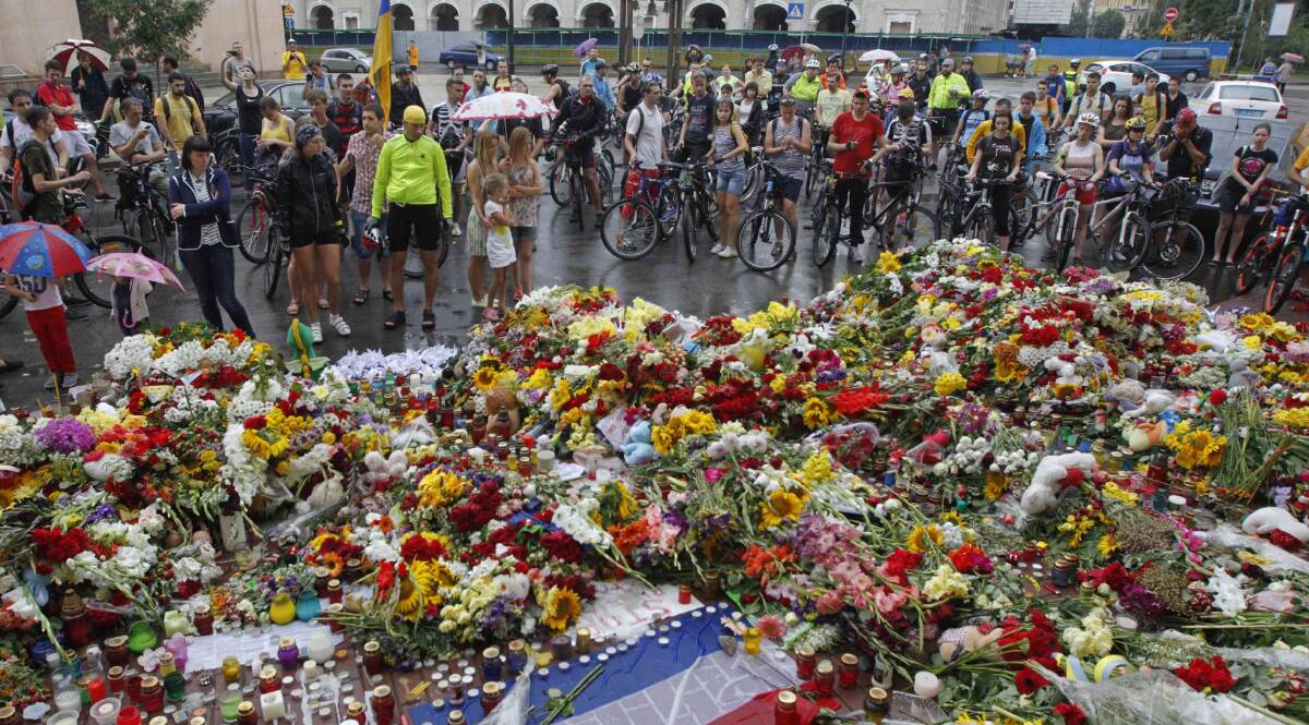 Flowers and messages left for victims of Malaysia Airlines flight MH17, outside the Dutch embassy in Kiev on July 19. Picture: Valentyn Ogirenko, Reuters. 
